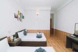 Postel nebo postele na pokoji v ubytování AN TÂM House Đà Lạt