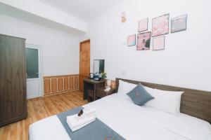 Postel nebo postele na pokoji v ubytování AN TÂM House Đà Lạt