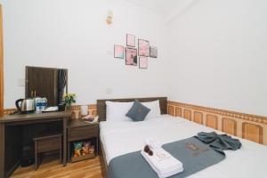 Postel nebo postele na pokoji v ubytování AN TÂM House Đà Lạt