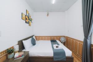 Postel nebo postele na pokoji v ubytování AN TÂM House Đà Lạt