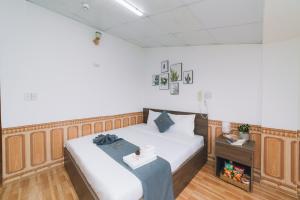 Postel nebo postele na pokoji v ubytování AN TÂM House Đà Lạt