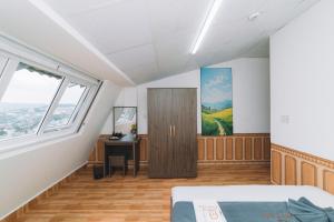 Postel nebo postele na pokoji v ubytování AN TÂM House Đà Lạt