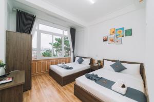 Postel nebo postele na pokoji v ubytování AN TÂM House Đà Lạt