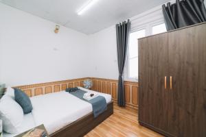Postel nebo postele na pokoji v ubytování AN TÂM House Đà Lạt