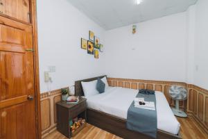 Postel nebo postele na pokoji v ubytování AN TÂM House Đà Lạt
