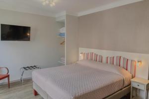 Postel nebo postele na pokoji v ubytování Hotel Maquis et Mer