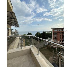 a view of the ocean from the balcony of a building at Seaside Apartment Nesebar in Nesebar
