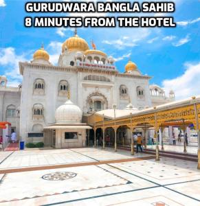 a large white building with gold domes on it at Hotel Star V - Front of New Delhi Railway Station in New Delhi