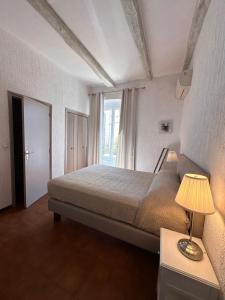 Postel nebo postele na pokoji v ubytování Hotel Maquis et Mer