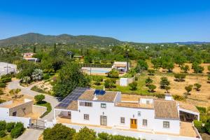 an aerial view of a house with solar panels on its roof at Casa do Carmo in Moncarapacho