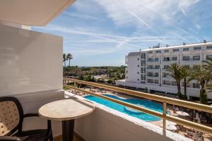 a balcony with a view of a pool and a building at ALEGRIA Florida Park in Santa Susanna