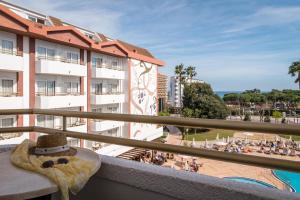 a view of the beach from a balcony of a hotel at ALEGRIA Florida Park in Santa Susanna