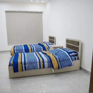 Postel nebo postele na pokoji v ubytování شاليه gerasa breeze resort + 34 fotografií