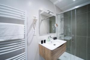 Ванная комната в Suites Coronell d'En Vila