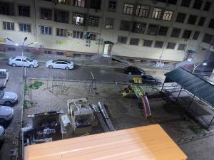 a view from a window of a parking lot at Уютная квартира в центре города in Samarkand