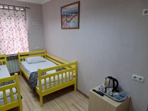Cama o camas de una habitación en Guest house "Golden Gate 911 "