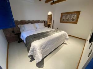 Łóżko lub łóżka w pokoju w obiekcie Villa Hortensia