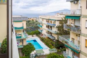a view from the balcony of a building with a swimming pool at Casa Patty Sorrento in Sorrento