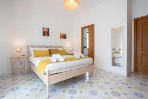 a bedroom with a bed with towels on it at Casa Patty Sorrento in Sorrento +51 photos