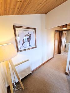 a room with a picture of a deer on the wall at Lomond 5 with Private Hot Tub - Fife - Loch Leven - Lomond Hills - Pet Friendly in Kelty