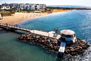 an aerial view of a pier and a beach at Thalassa Beach Resort 1 Bedroom with a partial Sea View and Courtyard View in Vokolidha