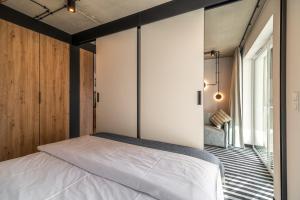 Posteľ alebo postele v izbe v ubytovaní Nadmorski Loft GREEN PORT SPA - 750 m od plaży
