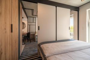 Posteľ alebo postele v izbe v ubytovaní Nadmorski Loft GREEN PORT SPA - 750 m od plaży