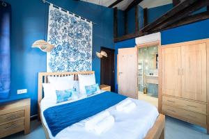 Кровать или кровати в номере Suites Coronell d'En Vila