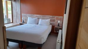 Postel nebo postele na pokoji v ubytování Calafate Apart Hotel