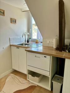 a kitchen with a sink and a counter top at Le cocon, T2, hypercentre in Cherbourg en Cotentin