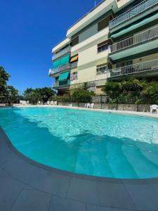 a large swimming pool in front of a building at Casa Patty Sorrento in Sorrento