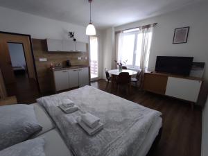 A bed or beds in a room at Symple apartments