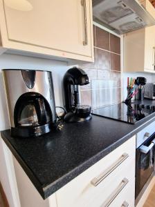 a kitchen counter top with a coffee maker on it at Torridon 12 with Private Hot Tub - Fife - Loch Leven - Lomond Hills in Kelty