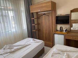 Postel nebo postele na pokoji v ubytování Dilhan Hotel