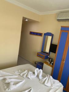Postel nebo postele na pokoji v ubytování Dilhan Hotel