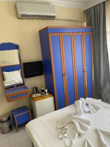 Postel nebo postele na pokoji v ubytování Dilhan Hotel