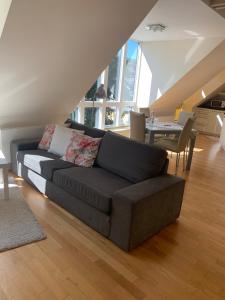 a living room with a couch and a table at Casa Cinzia Lucia in Eckernförde