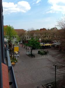a view of a courtyard with tables and chairs at Casa Cinzia Lucia in Eckernförde +12 photos