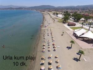 an aerial view of a beach with umbrellas at Hotel Barba in Urla