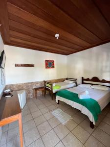 Postel nebo postele na pokoji v ubytování Pousada Brisamar Paraty COMECE O DIA COM UM CAFÉ DA MANHÃ INESQUECÍVEL