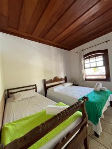 Postel nebo postele na pokoji v ubytování Pousada Brisamar Paraty COMECE O DIA COM UM CAFÉ DA MANHÃ INESQUECÍVEL