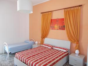 A bed or beds in a room at Appartamenti Blue House