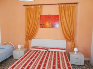 A bed or beds in a room at Appartamenti Blue House