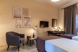 A bed or beds in a room at STUDIO SPYROS