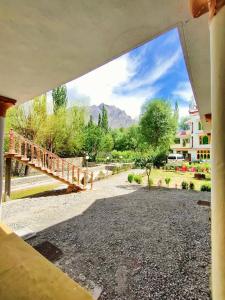 a view of a walkway from a building with a bridge at Trout Villa in Skardu