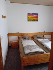 two bunk beds in a room with a picture on the wall at Haus Hinzberg in Oberhof