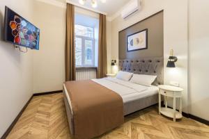 Postel nebo postele na pokoji v ubytování DayFlat Apartments