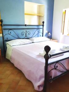 Ένα ή περισσότερα κρεβάτια σε δωμάτιο στο Il Mulino di Giulio
