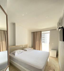 Postel nebo postele na pokoji v ubytování Hotel Cartagena Premium