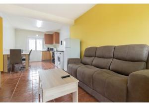 a living room with a couch and a table at El Trabaz in Candamo